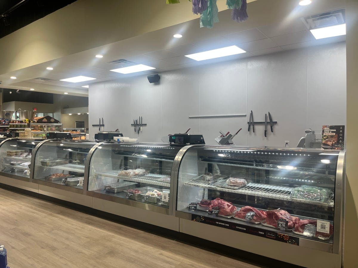 Carnicería butcher counter with fresh meats at Los Portales