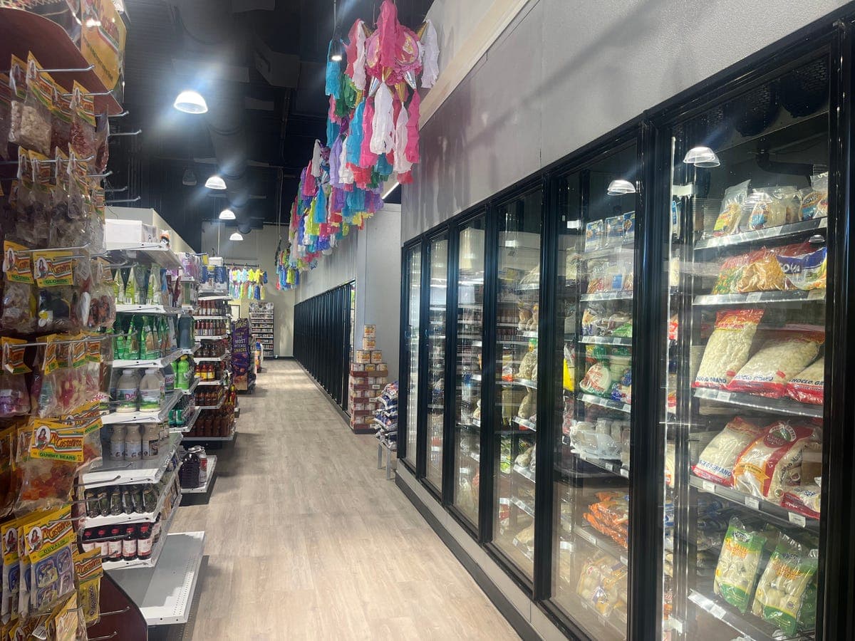 Freezer aisle with piñatas overhead at Los Portales
